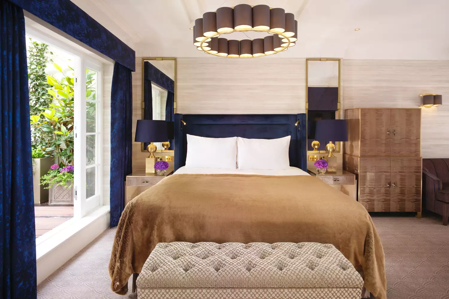 A refined guest room at the Flemings Mayfair hotel featuring high-end decor and luxury furnishings.