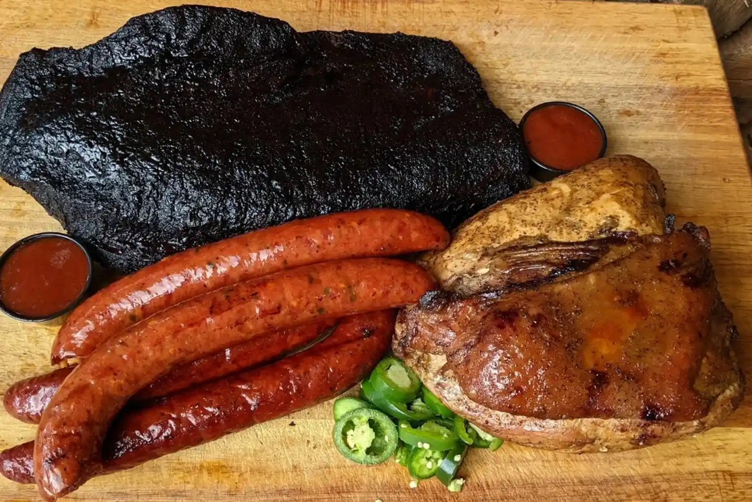 A platter of pit-smoked meats including brisket and sausage from CorkScrew BBQ.