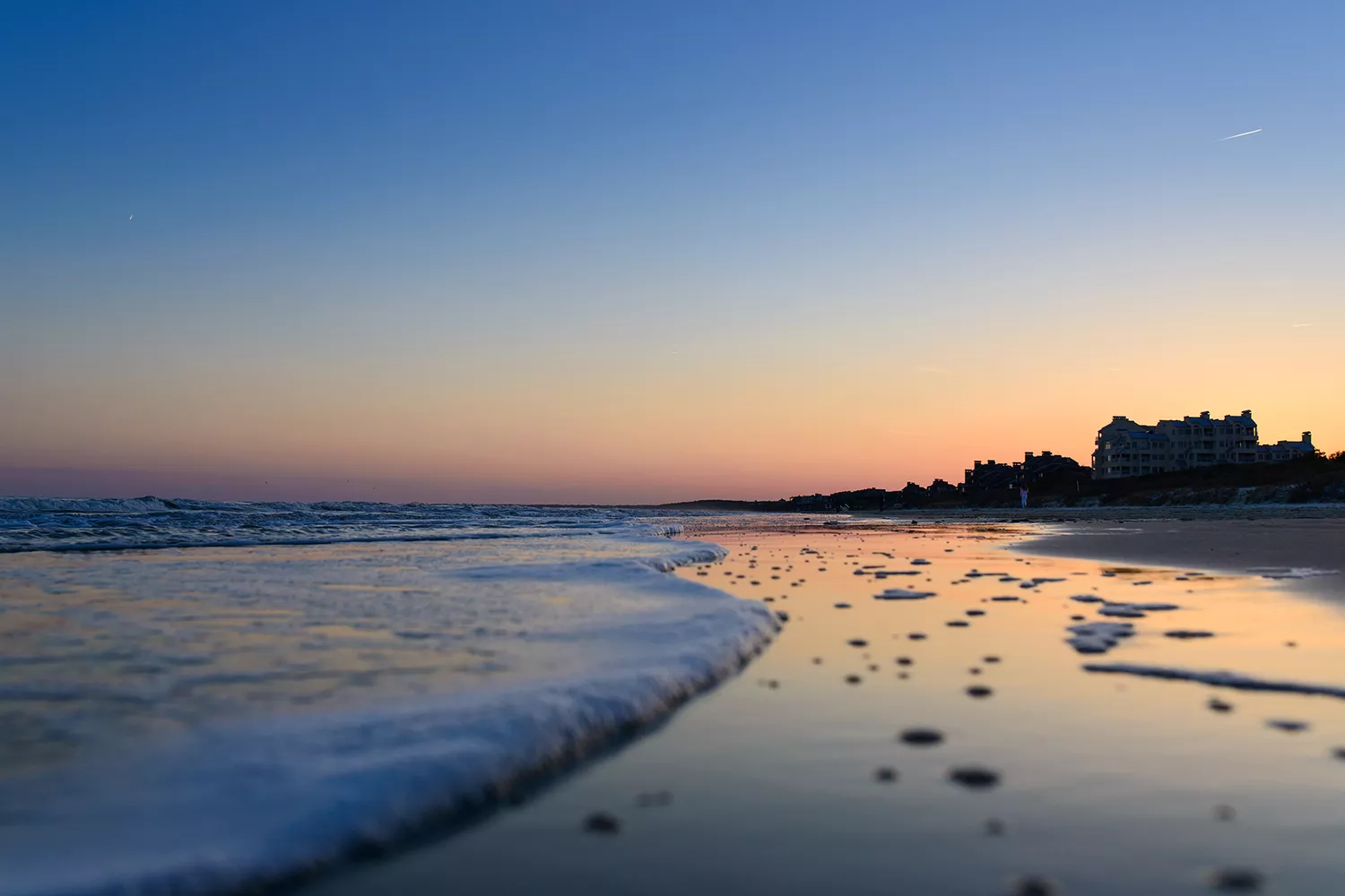 Golden sunset over the pristine shoreline and luxury beach environment of Kiawah Island.