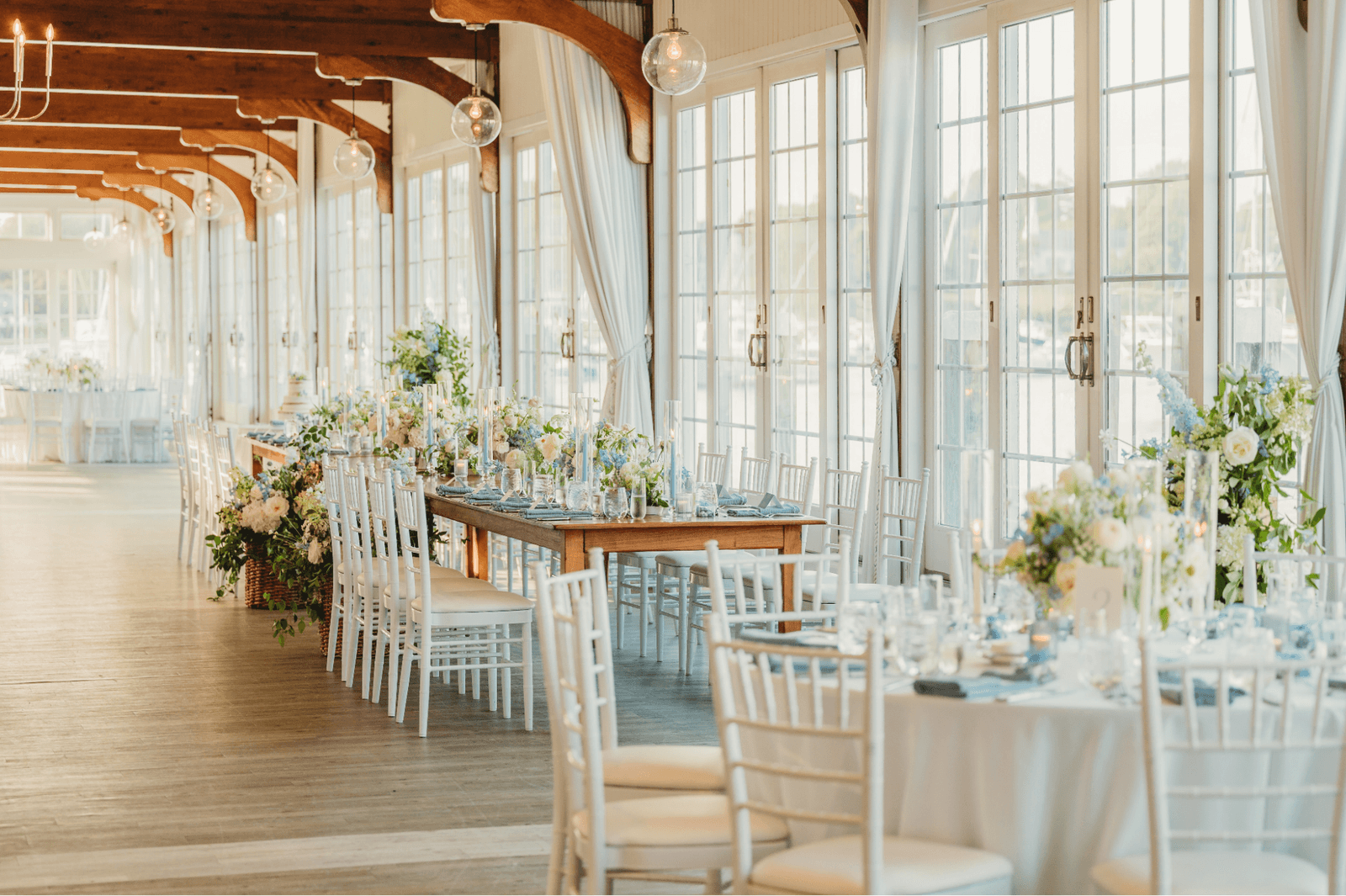 A sophisticated luxury dining room set for a wedding reception with contemporary architecture.