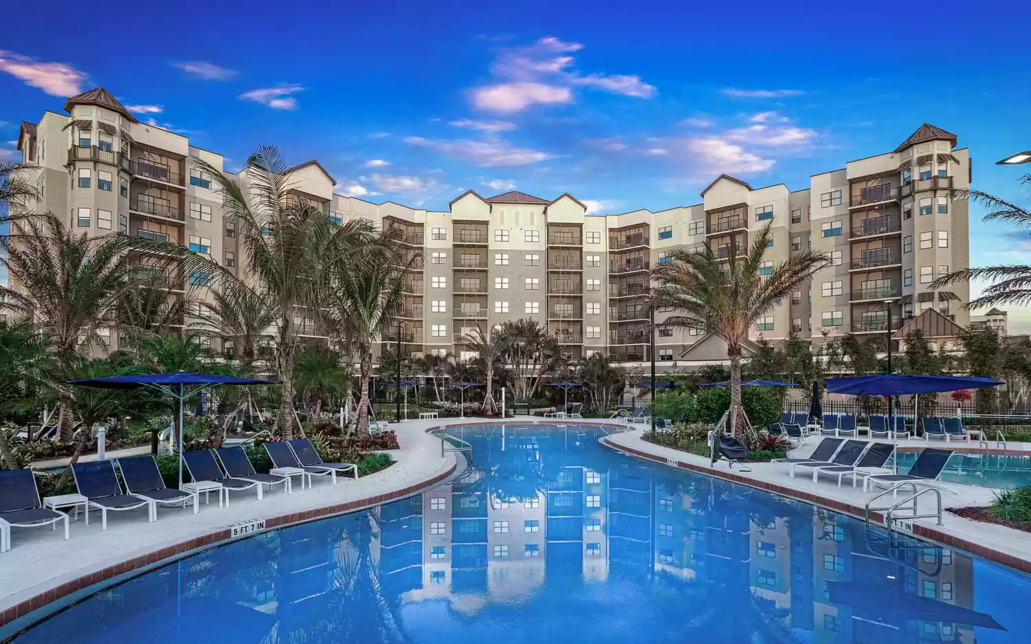 Aerial view of the winding lazy river and pool complex at The Grove Resort Orlando.