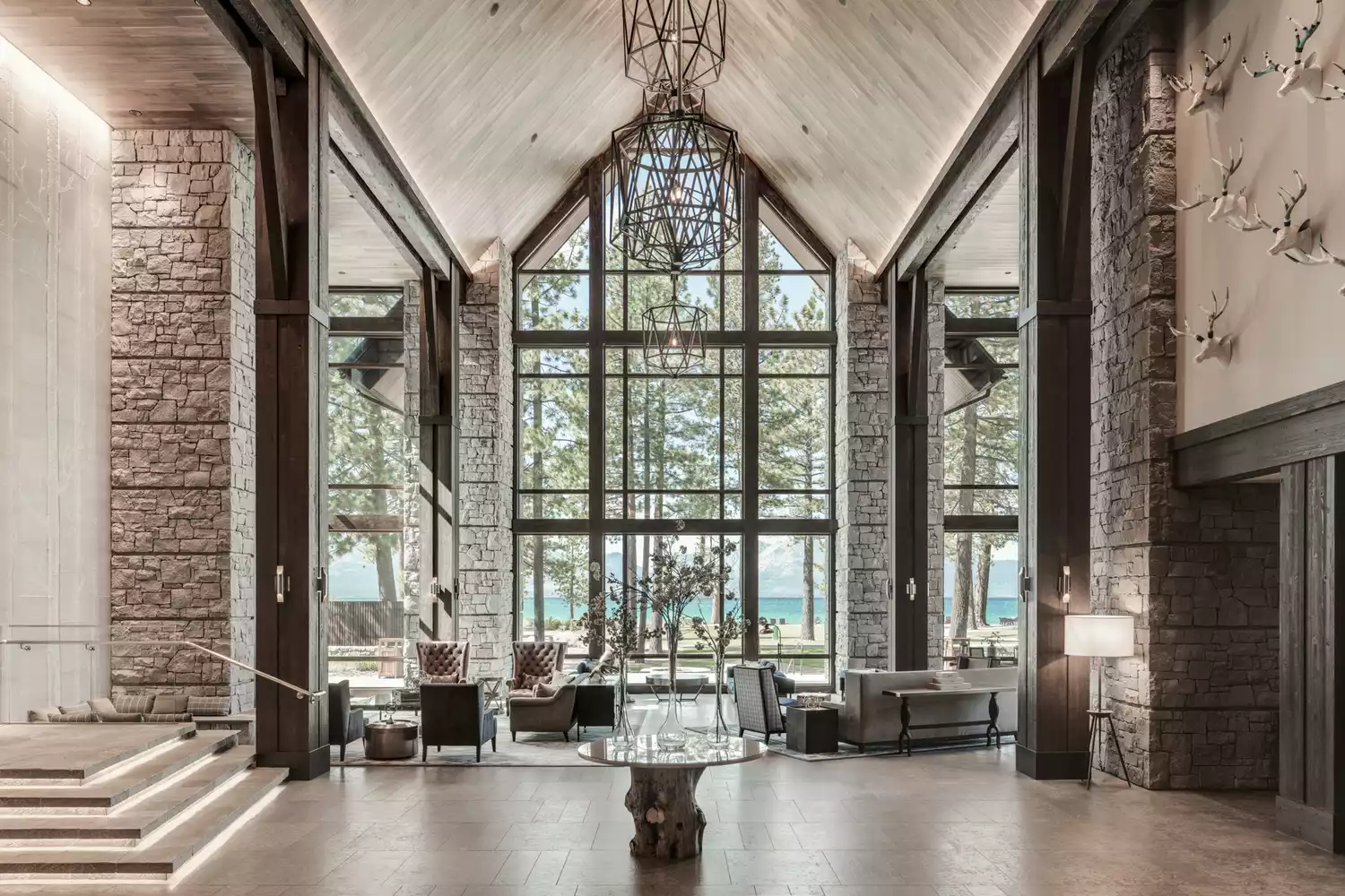 Wide view of the grand lobby at Edgewood Tahoe Resort with high ceilings and sophisticated decor.