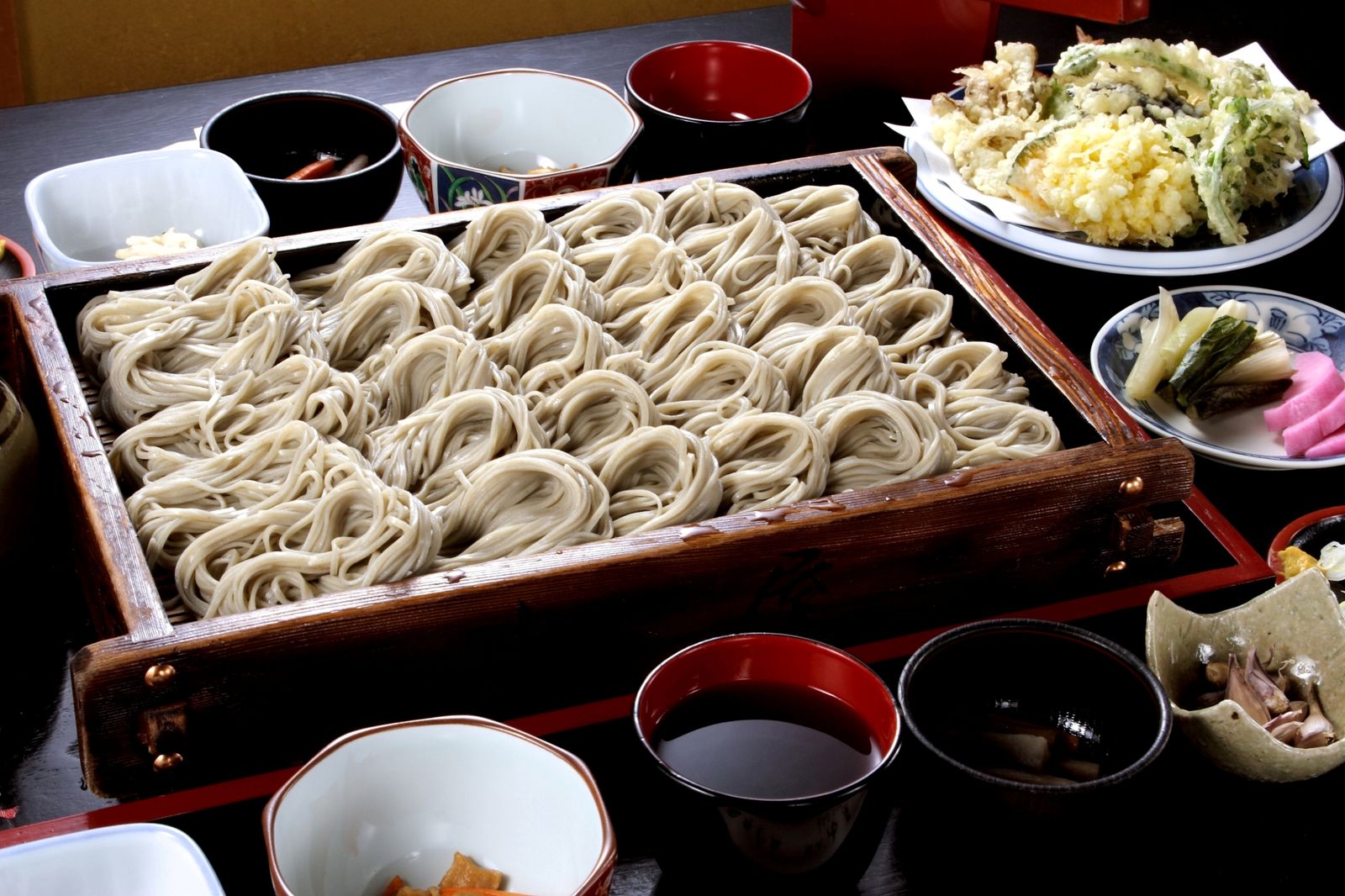A bowl of traditional Japanese noodles served with various toppings.