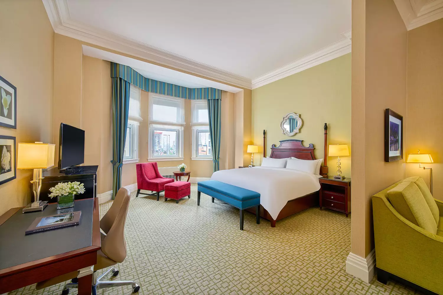 A modern and elegantly furnished Deluxe King guest room at the Fairmont Château Laurier.