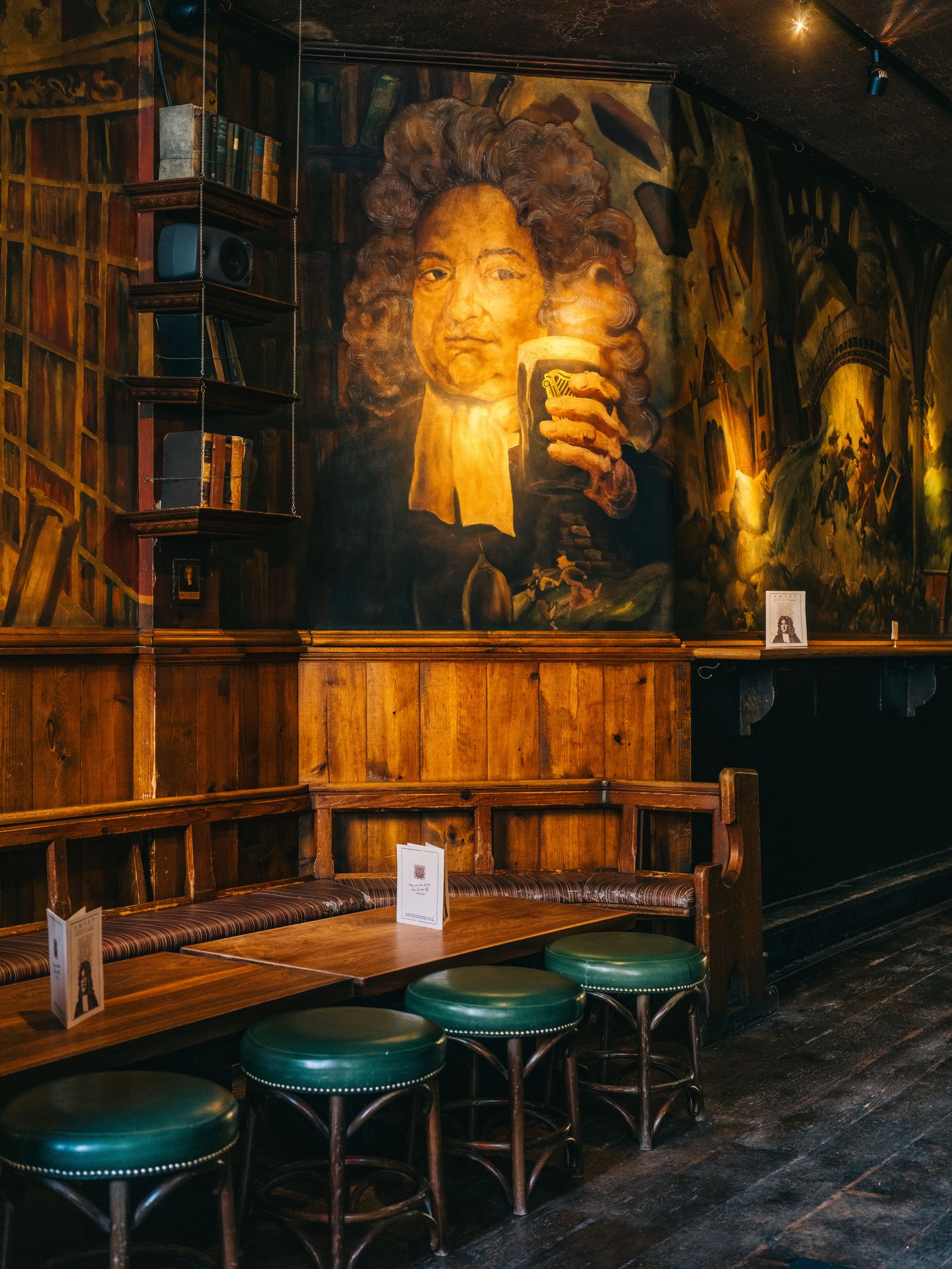 A framed portrait of Jonathan Swift on a pub wall, highlighting the historic theme.