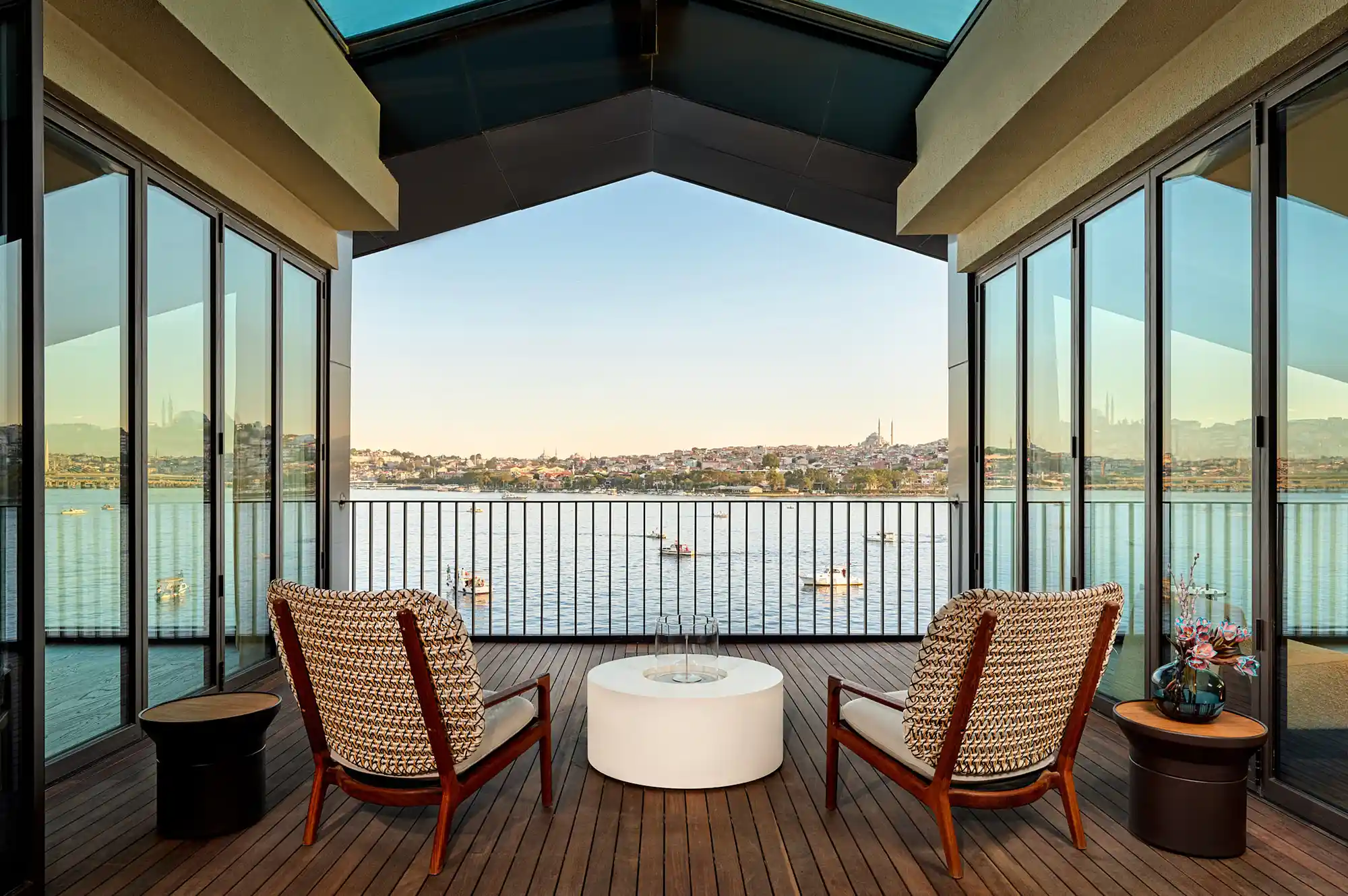 A private outdoor deck at Aliée Istanbul overlooking the Golden Horn with the city skyline in the background.