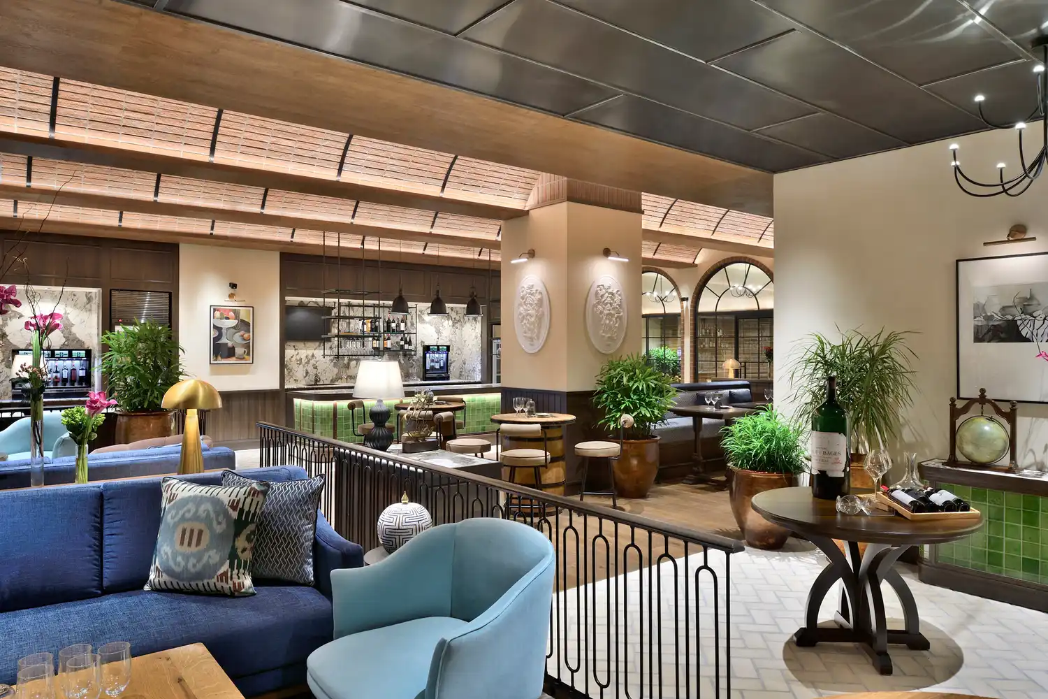 Interior view of the Captain's Cellar at Taj Mahal New Delhi, featuring a contemporary bar and lounge setting.