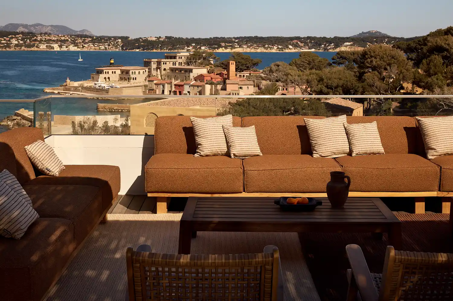 Rooftop view of the island harbor and surrounding coastal landscape.