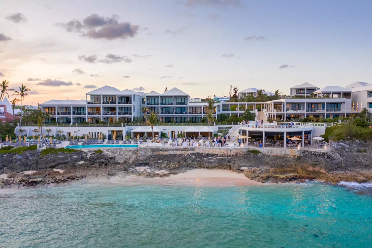Modern cliffside exterior of The Loren at Pink Beach overlooking the Atlantic Ocean.