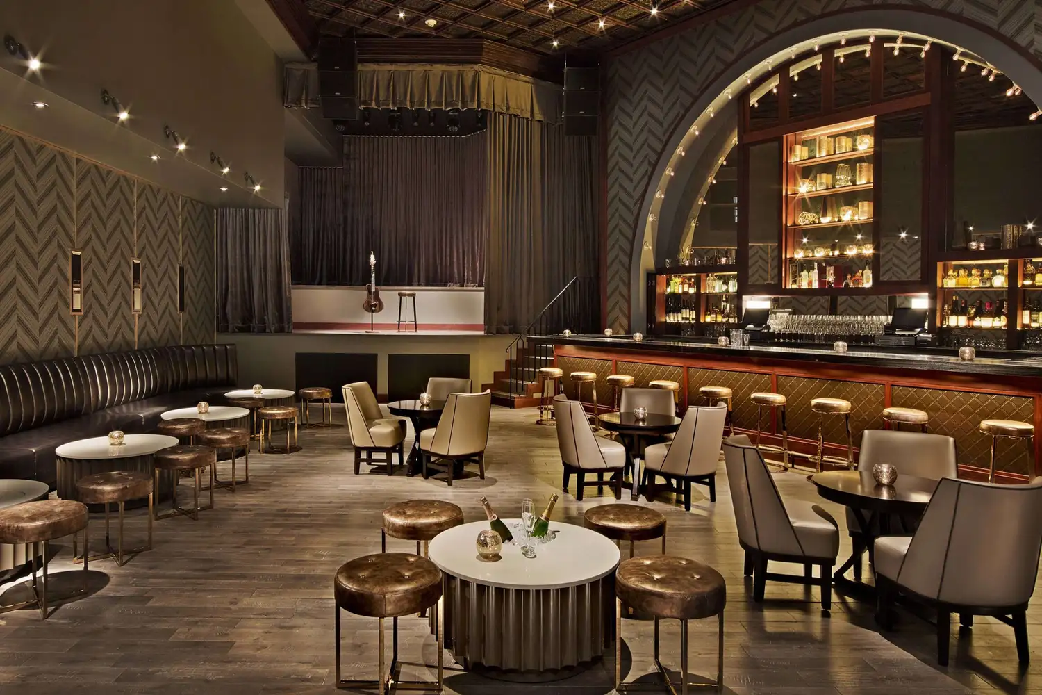 A stylish and luxurious bar area inside the Fairmont El San Juan Hotel with ambient lighting.