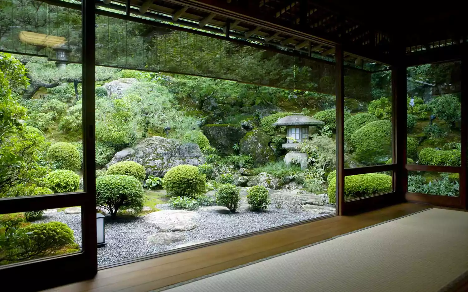 A traditional Japanese garden viewed from a tatami room in Kyoto.