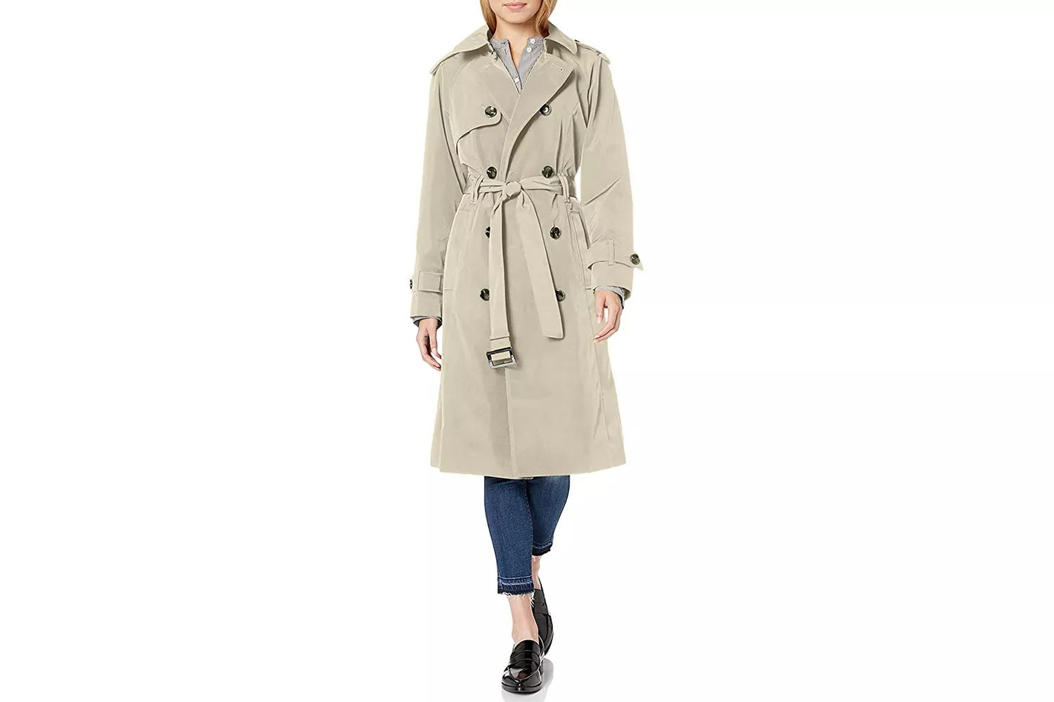 A woman wearing a classic double-breasted beige trench coat.