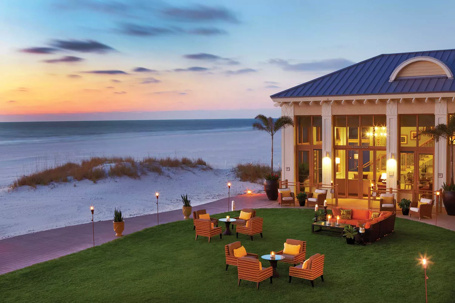 Interior of a Gulfside suite at Sandpearl Resort looking out toward the white-sand beach.