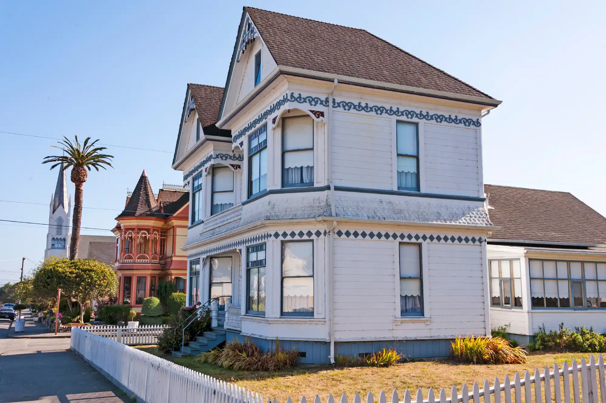 Victorian-style houses in Ferndale with ornate details and white picket fences.