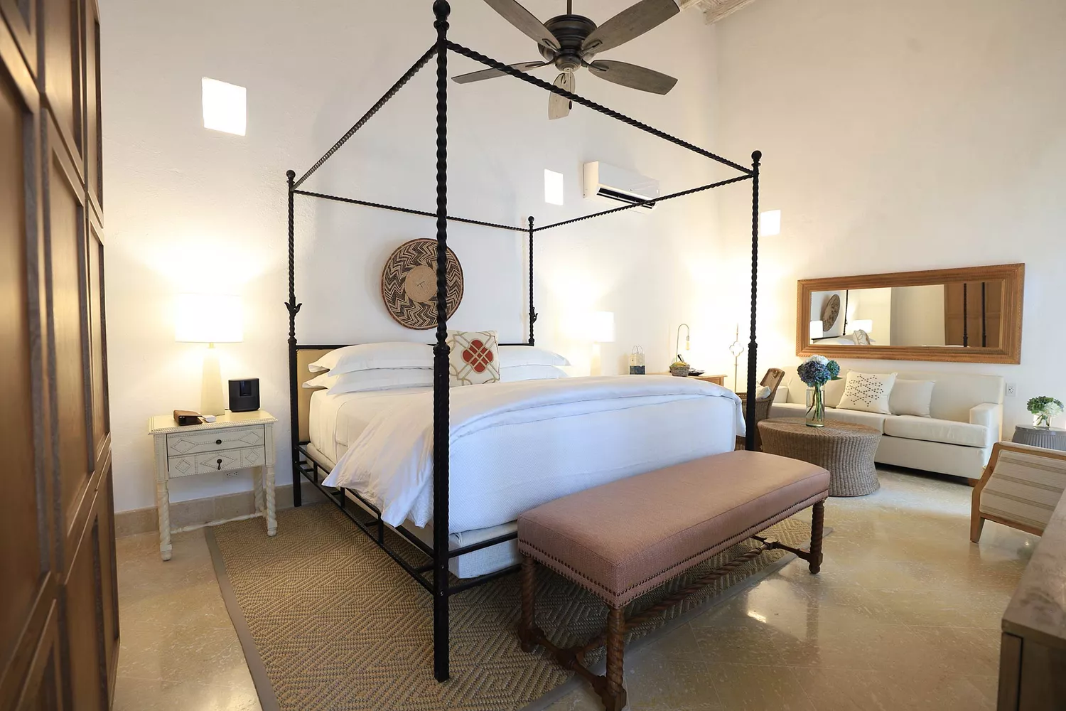 Interior of a refined guest suite at Casa Pestagua with high ceilings and luxury furnishings.