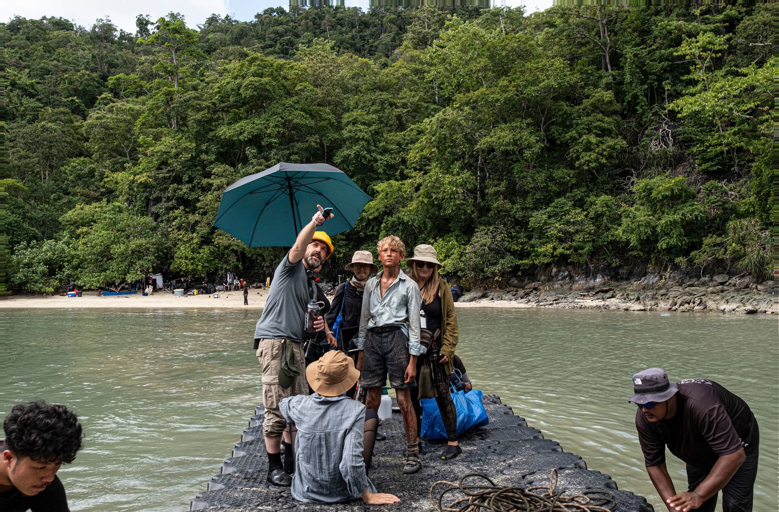A person with a backpack exploring a tropical destination.