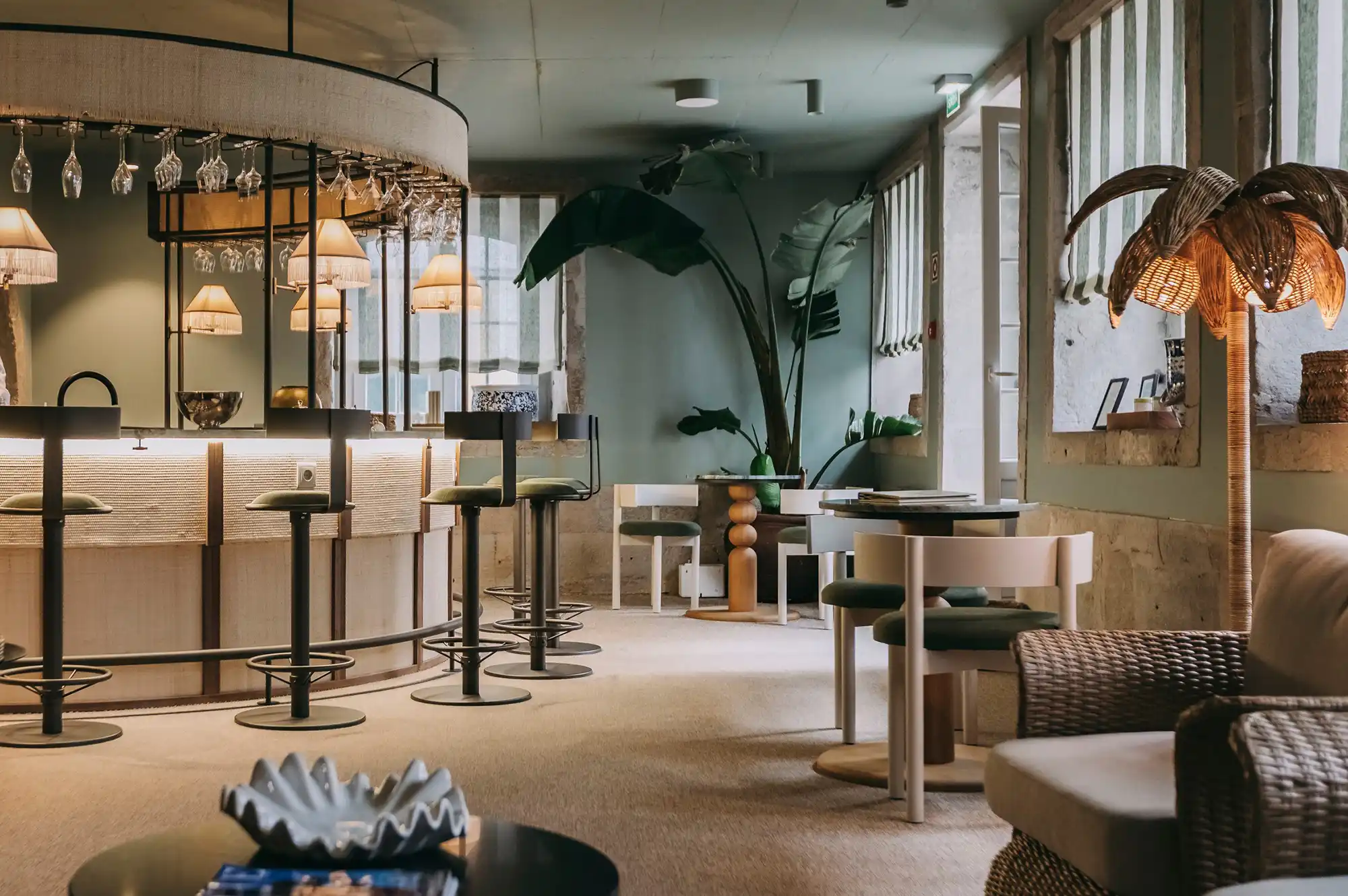 Interior view of Bistro TRÊS at Torel Terra Brava featuring a stylish bar and dining area.