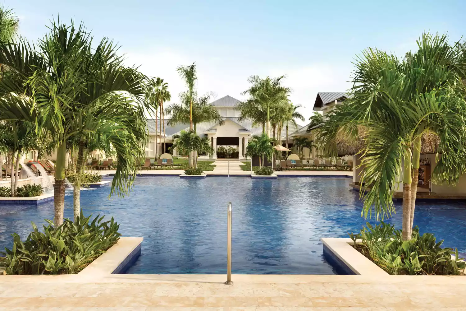 Large infinity-style swimming pool at Hilton La Romana resort.
