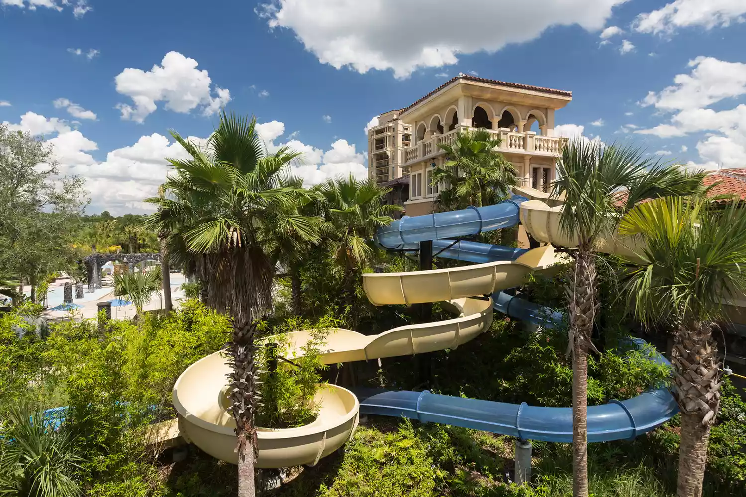 A children's water slide at the Four Seasons Resort Orlando featuring lush landscaping.