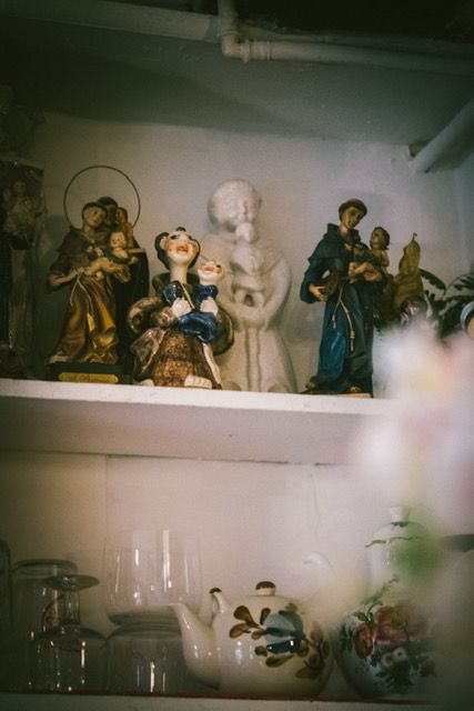 The interior of a historic Portuguese chapel with religious icons and traditional architecture.