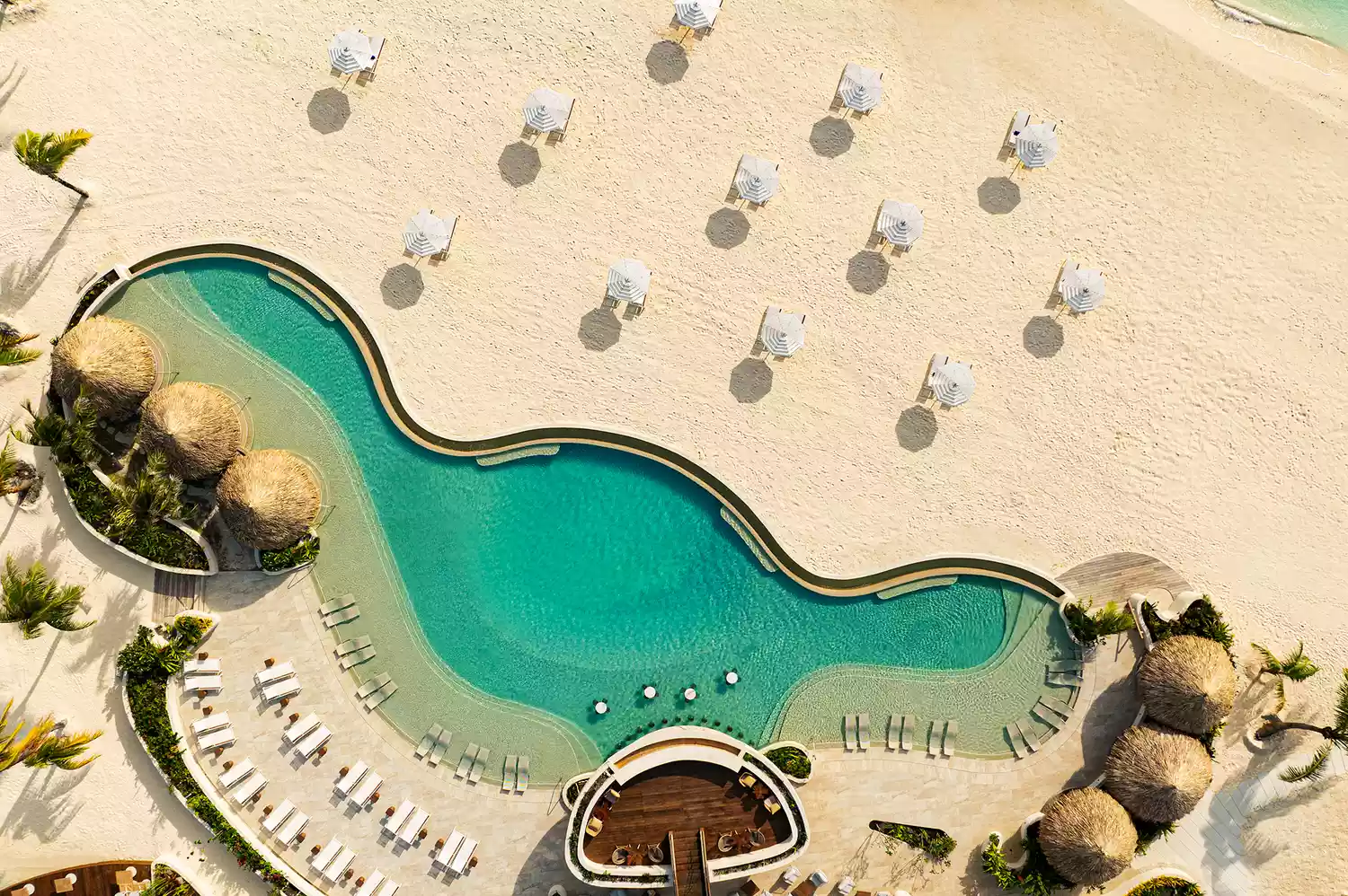 Aerial view of the Westin Bora Bora main pool, beach, and turquoise lagoon.