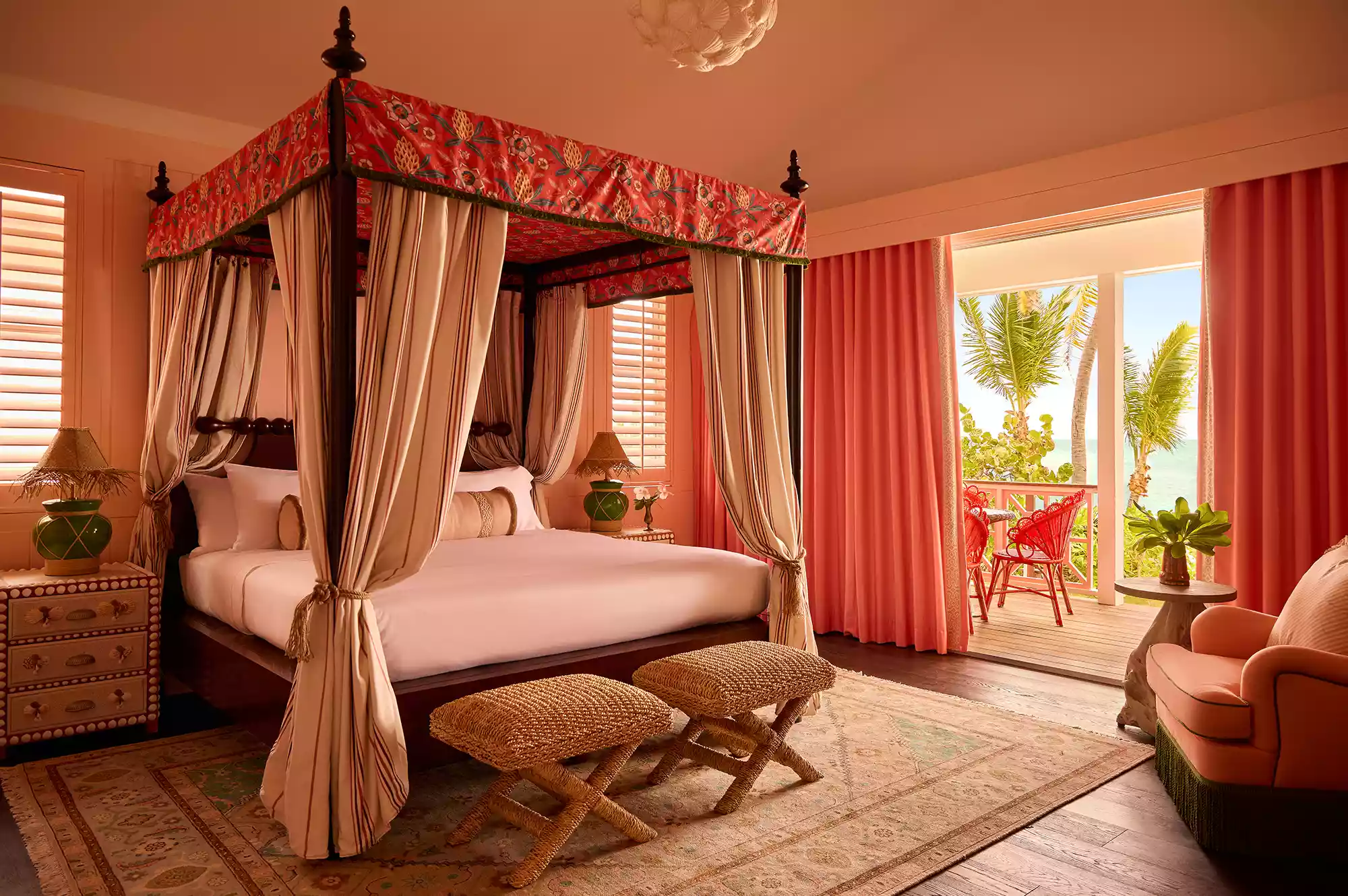 A bright guest room at Coral Sands with rattan furniture and coastal-inspired decor.