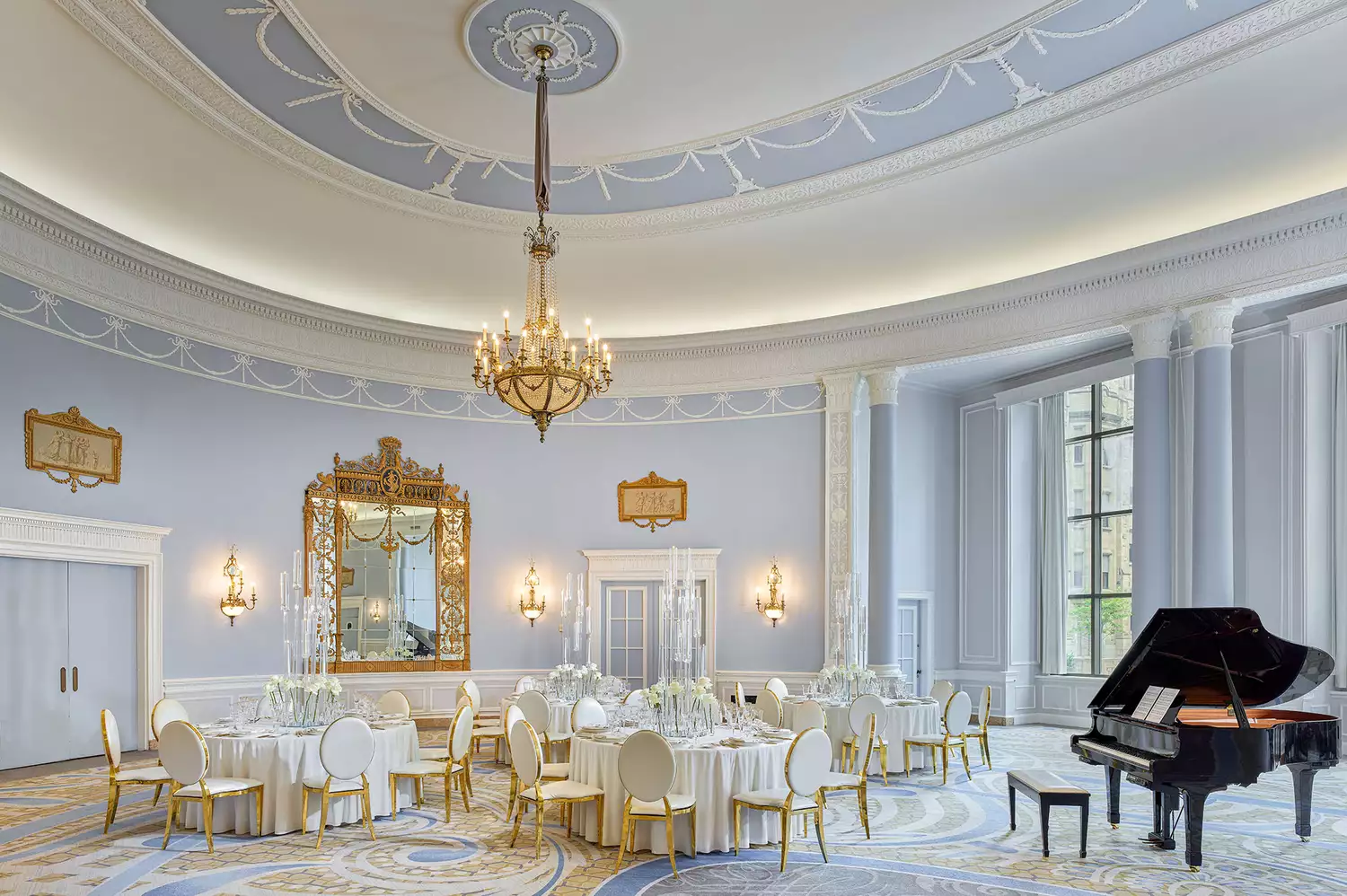 The ornate Adam Room ballroom at Fairmont Château Laurier, featuring Wedgwood-style architectural details.