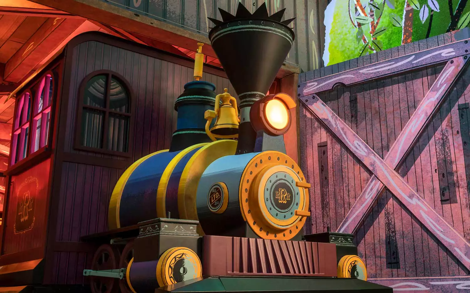 Engineer Goofy on a train engine in the Mickey & Minnie’s Runaway Railway attraction.