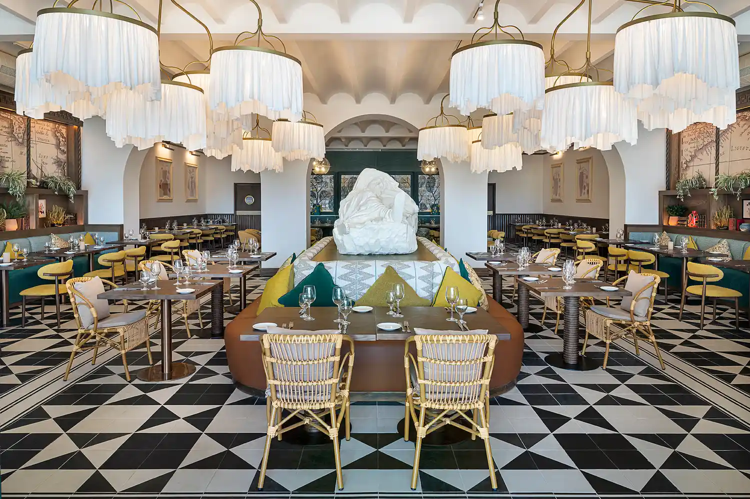 Upscale dining room interior at La Locanda with ornate chandeliers and modern decor.