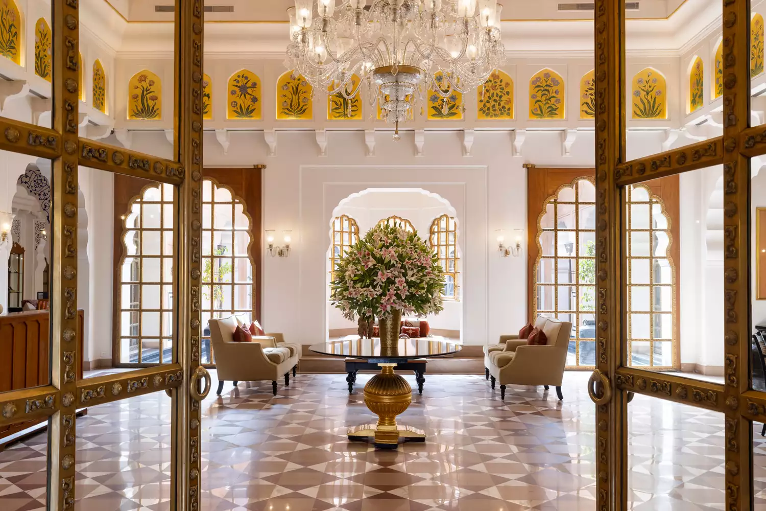 Ornate stone entryway and traditional Rajasthani architectural details at The Oberoi Rajvilas in Jaipur.