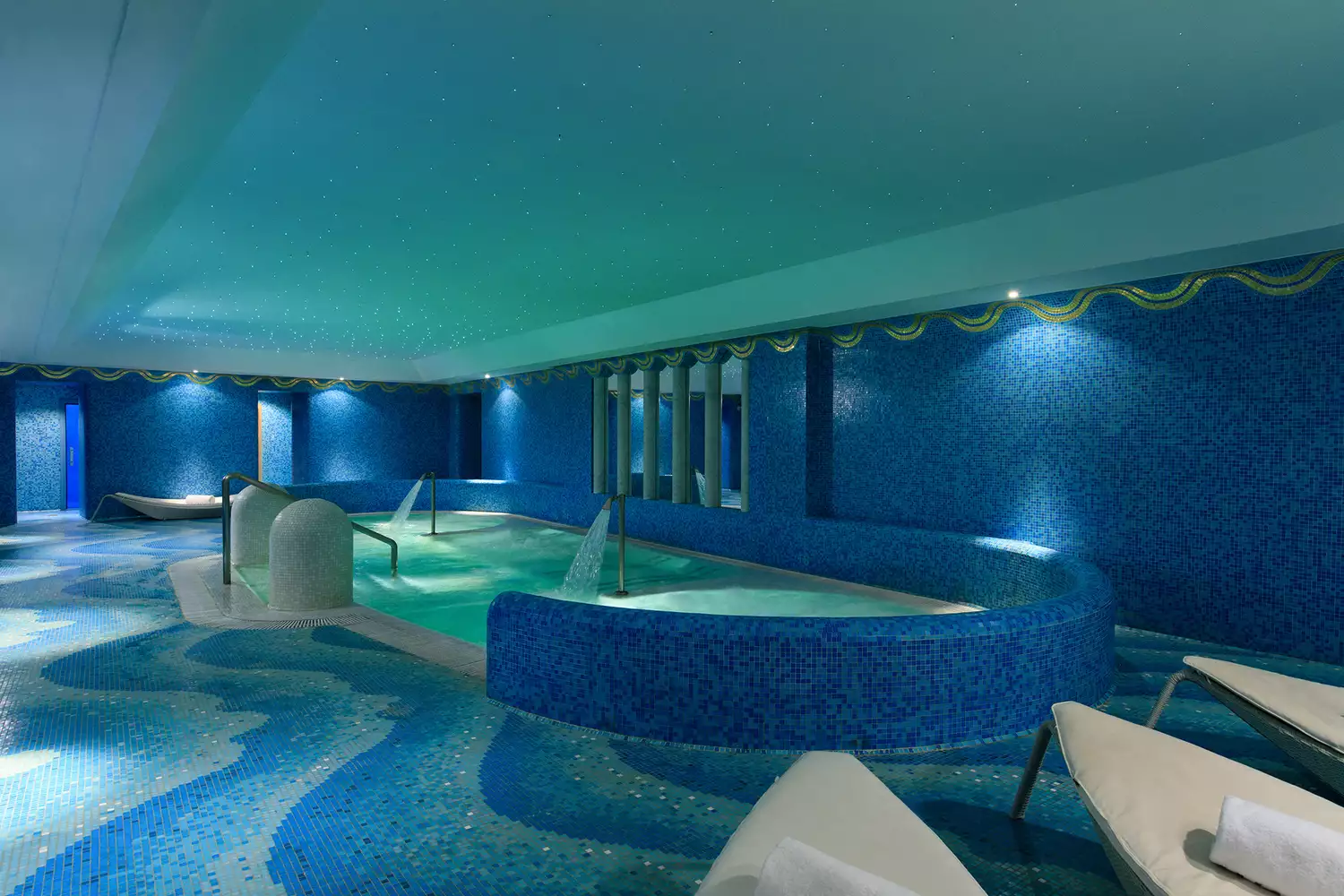 The calming interior and pool area of the luxury spa at Hotel de Russie.