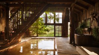 Modern indoor pool architecture with natural lighting and water features.