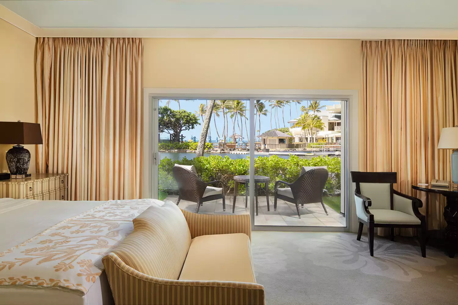 A luxury guest room at The Kahala Hotel with classic island-style decor and ocean views.