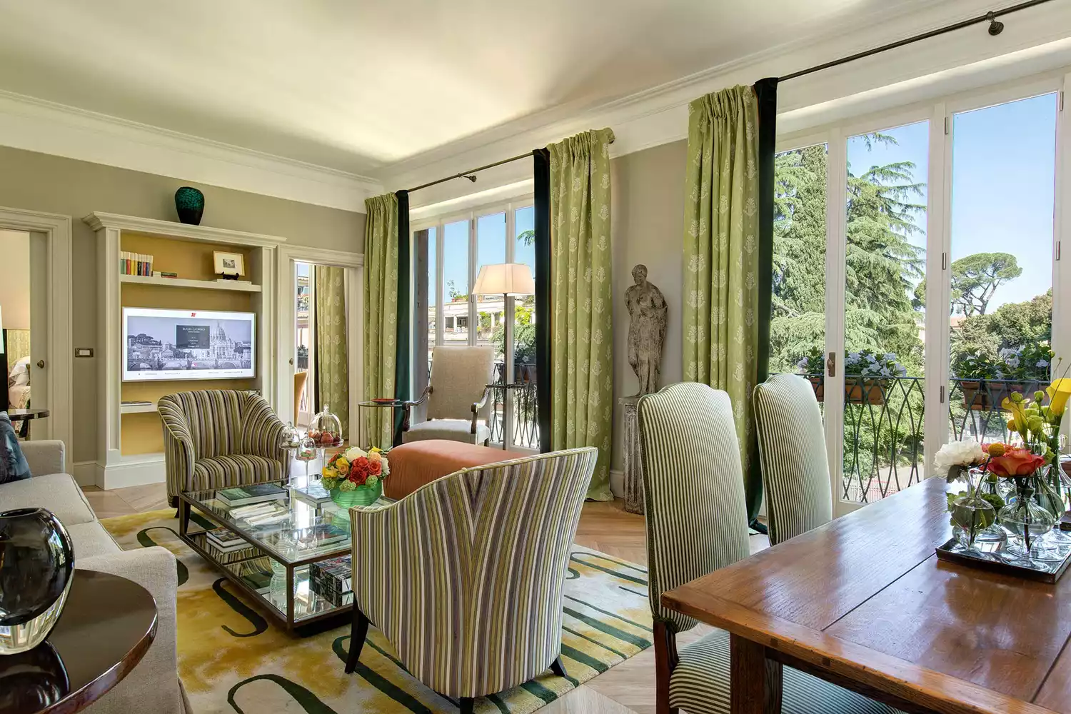The interior of the Valadier Suite at Hotel de Russie featuring elegant furniture and historic architecture.