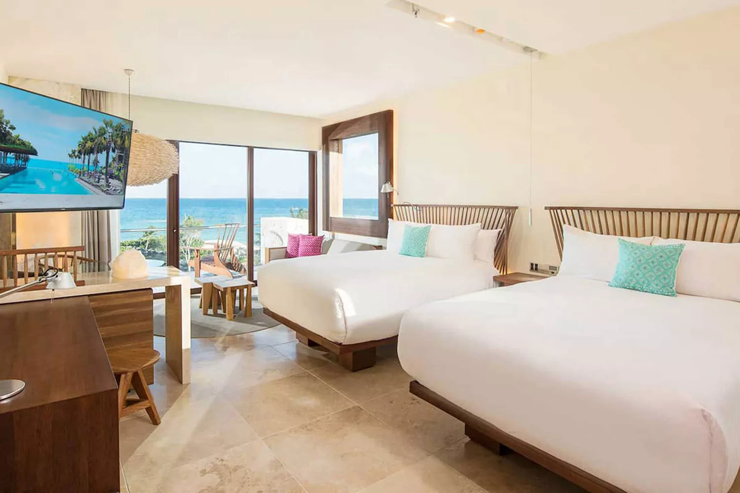 The exterior landscape and iconic architecture of Hotel Xcaret Mexico in Playa del Carmen.